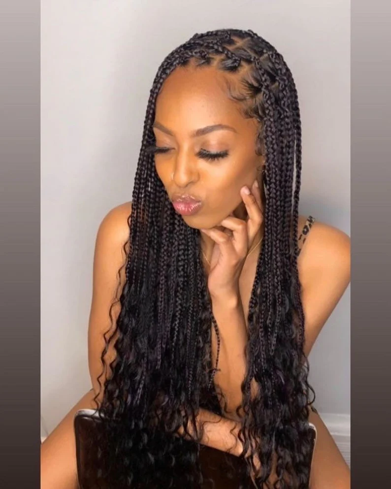 knotless braids with curls at the end