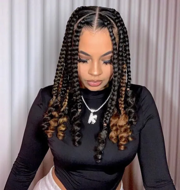 medium box braids with curls at the end